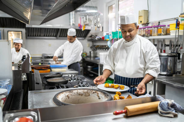 istock Indian chef creating delicious food 1964912184