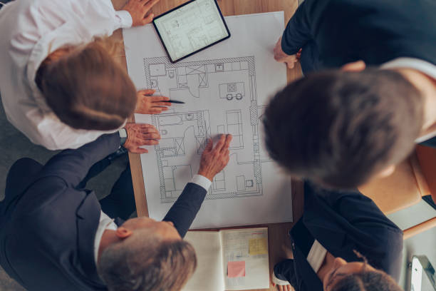 istock Top view of professional business managers working with project documents in office 1964943466