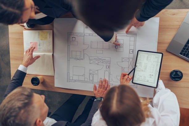 istock Top view of professional business managers working with project documents in office 1964943503