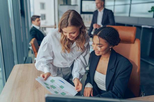 istock Business colleagues working in modern corporate office during working day. Teamwork concept 1964944609