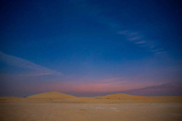 istock Desert sand dune with beautiful clouds 1964963186