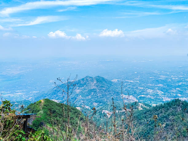 istock Tropical hills with cloudy blue-sky background 1964971715