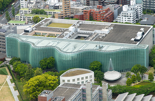 Tokyo, Japan; April 23, 2023; High angle view of the National Art Center with curved or waive-like glass curtain wall façade in Roppongi, Minato