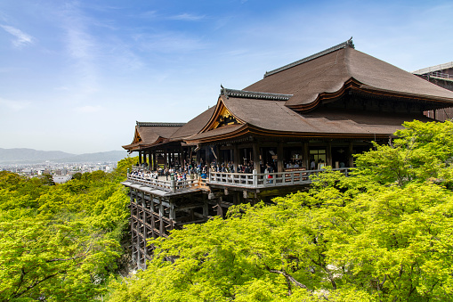 Higashiyama Ward, Kyoto, Japan; April 14, 2023; Kiyomizu-dera Buddhist temple (Pure Water Monastery) and UNESCO World Heritage Site with people and the city in the background