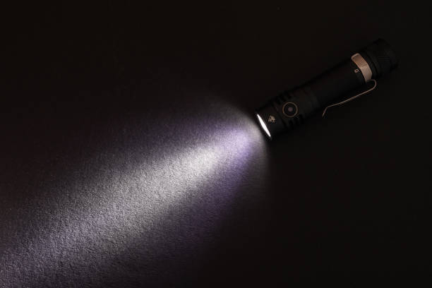 istock Flashlight and beam of light on a dark background 1965003518