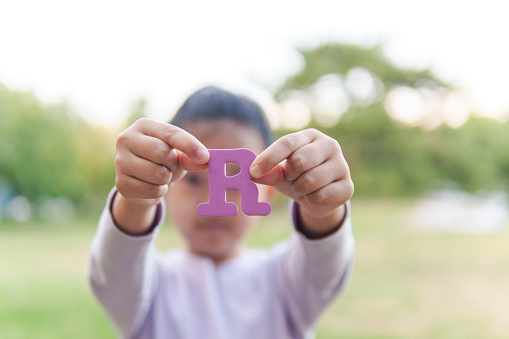 Child Holding Letter \