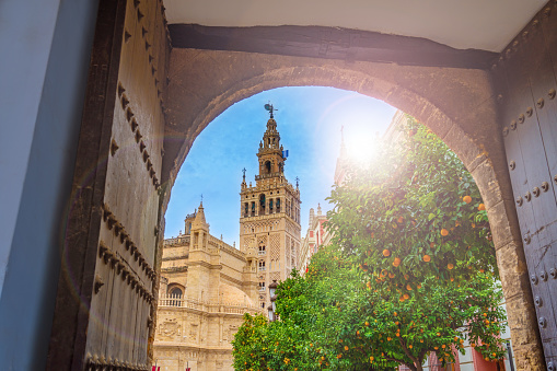 Giralda of Sevilla cathedral belfry tower in blue sky of Andalusia Spain