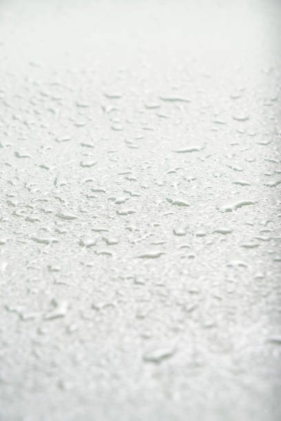 istock Light abstract background, texture covered with raindrops by condensation. 1965035360