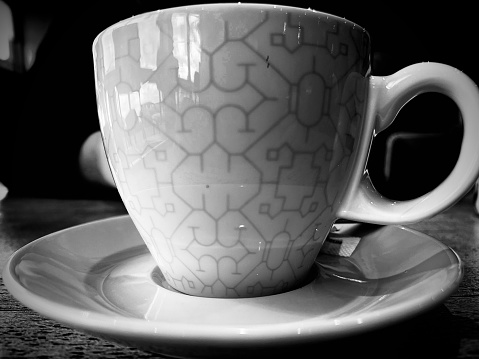 A patterned coffee cup and saucer