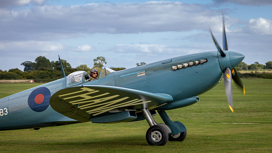 Old Warden,UK - 2nd October 2022: A British World War 2 Spitfire fighter aircraft, taxiing on grass close up