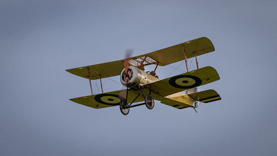 Old Warden, UK - 2nd October 2022: Vintage Sopwith Pup biplane in flight low over airfield. Close up shot