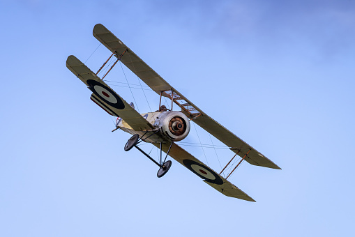 Old Warden, UK - 2nd October 2022: Vintage Sopwith Pup biplane in flight low over airfield. Close up shot