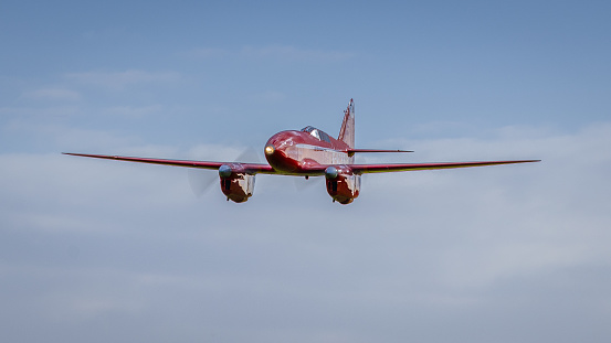 Old Warden, UK - 2nd October 2022: The historic De Haviland DH88 Comet racing aircraft flying low over airfield