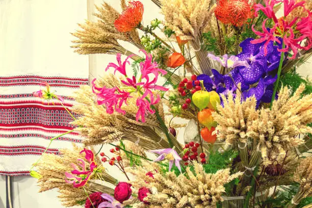 Composition of flowers and dry ears of wheat. Ukrainian style.