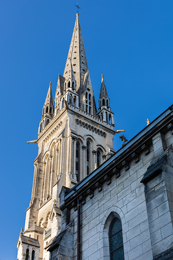 The bell tower of the Saint-Martin church, religious building in neo-Gothic architecture. Pau, Pyrénées-Atlantiques, France.