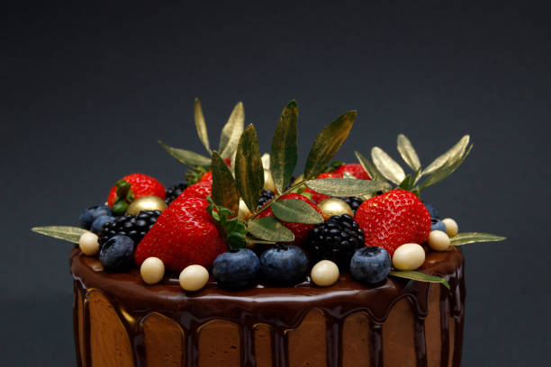 istock Chocolate cake in chocolate glaze with strawberries 1965071955