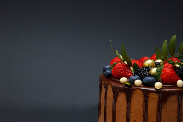 istock Chocolate cake in chocolate glaze with strawberries 1965071958