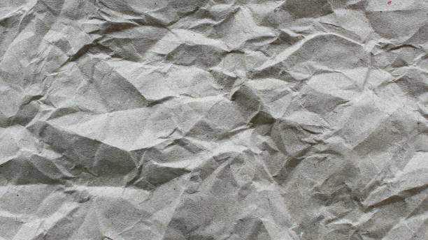 istock crumpled paper texture close up. crumpled paper abstract background 1965073315