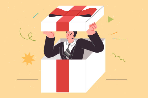 geschäftsgeschenk mit mann in einer riesigen box, die mit einer roten schleife verziert ist, die ein geschenk für partner symbolisiert - jubilee bow gift red stock-grafiken, -clipart, -cartoons und -symbole