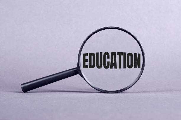 istock Magnifying glass with EDUCATION lettering on a gray background. 1965074181