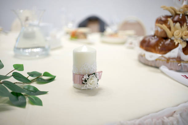 istock A decoratively decorated candle for the festive table. 1965074221