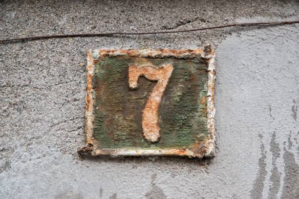 istock Old retro cast iron plate number 7 1965074294