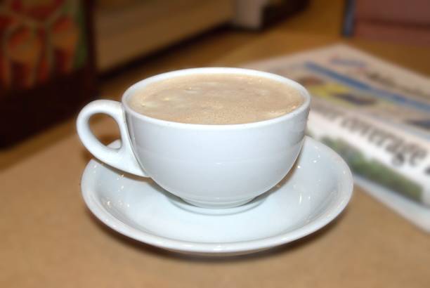 istock Coffee cup on the table in coffee shop 1965076915