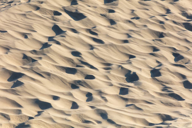 White sand in nature as an abstract background. Texture.