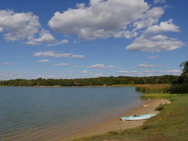 istock Lake Murray with a boat on the shore and blue sky with white clouds, Oklahoma. 1965101811