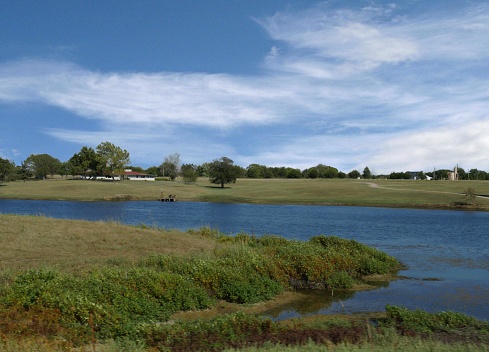 Farm view with a pond in Oklahoma, USA.