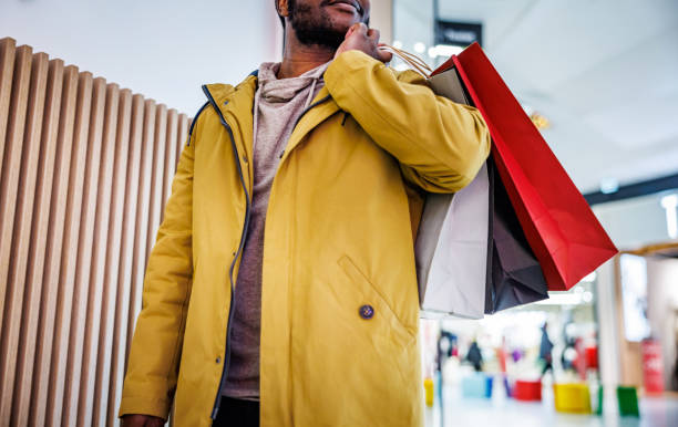istock Man carries shopping bags 1965118647