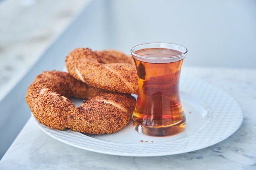 Traditional Turkish breakfast. National food, Turkish tea and semite bun.