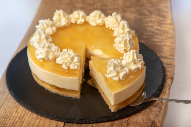 istock Homemade lemon cheesecake cake decorated with whipped cream. 1965153654