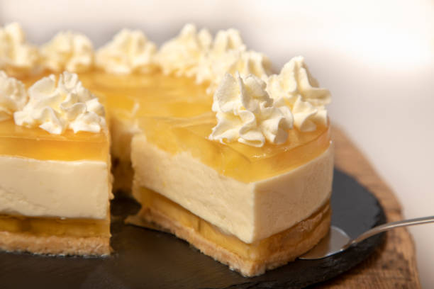 istock Homemade lemon cheesecake cake decorated with whipped cream. 1965154184