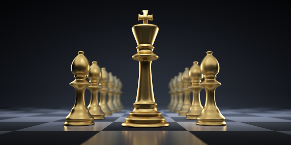 Chess Pieces - two rows of golden bishops with golden King on dark chessboard with dark background - 3D illustration