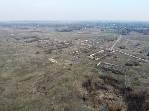 The ruins of a livestock farm, aerial view. Destroyed animal sheds.