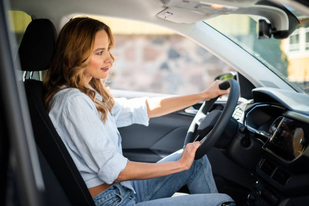 istock Young lady driving her car 1965166774