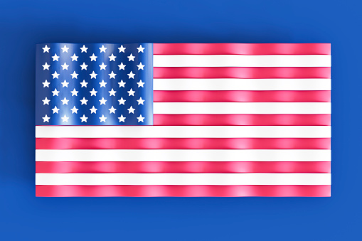 American flag waving in the wind. Background with copy space