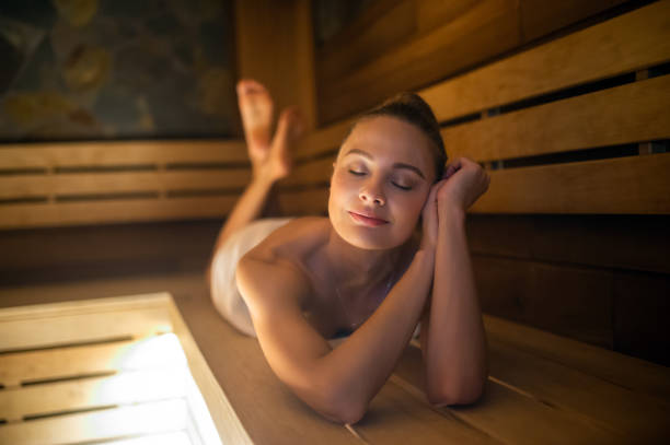istock Woman relaxing in a sauna 1965168446