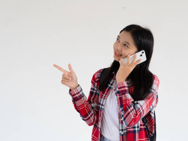 istock Asian young girl using smartphone at school. 1965208998
