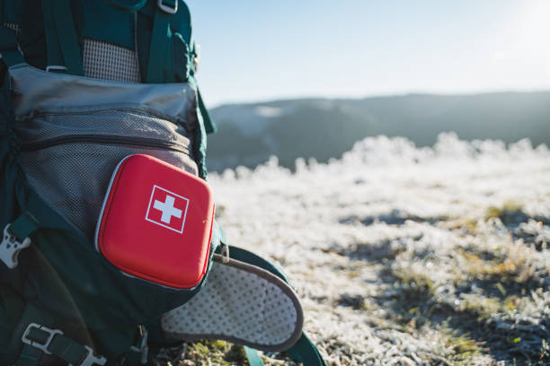 istock A red first aid kit is on the backpack, tourist equipment. 1965211636