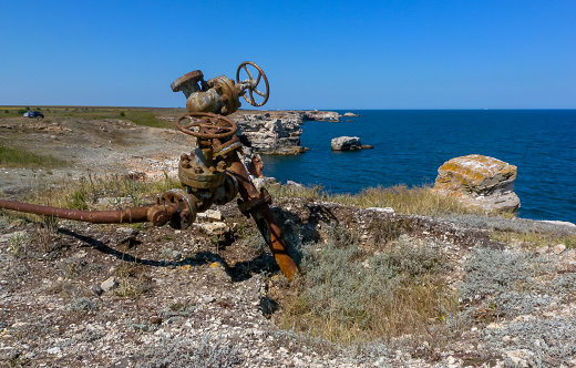 Bulgari, Tiulenovo - April 02, 2013: oil production from old wells on the seashore near the village of Tyulenovo, Black Sea, Bulgaria