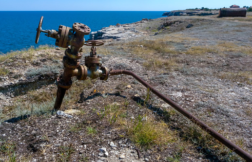 Bulgari, Tiulenovo - April 02, 2013: oil production from old wells on the seashore near the village of Tyulenovo, Black Sea, Bulgaria