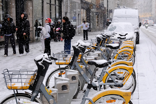 Parking of public bicycle in central Brussels during a heavy snowfall in Belgium on January 17, 2024.