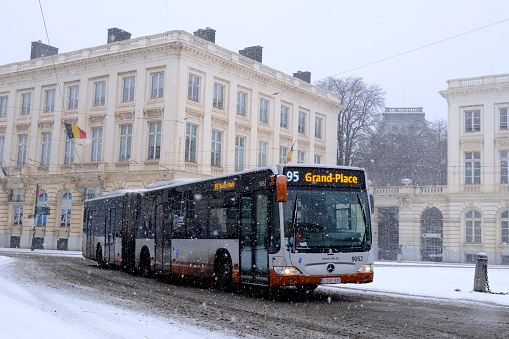 Public bus on its way in central Brussels during a heavy snowfall in Belgium on January 17, 2024.
