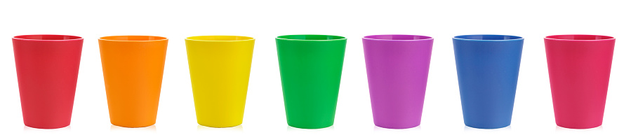 a lot of colored plastic glass on a white background isolated. clipping path