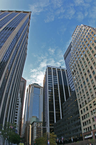 USA, New York - November 18, 2009: Manhattan skyscrapers, bottom-up view on blue sky background, USA