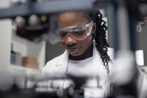 istock Female Laboratory Specialist in Protective Goggles 1965289635