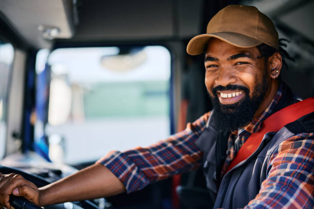 istock Happy black professional truck driver looking at camera. 1965301408