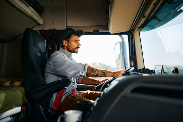 istock Professional truck driver on the road. 1965301924